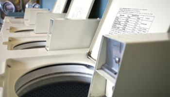laundrymat washer dryer closeup clothes drycleaner